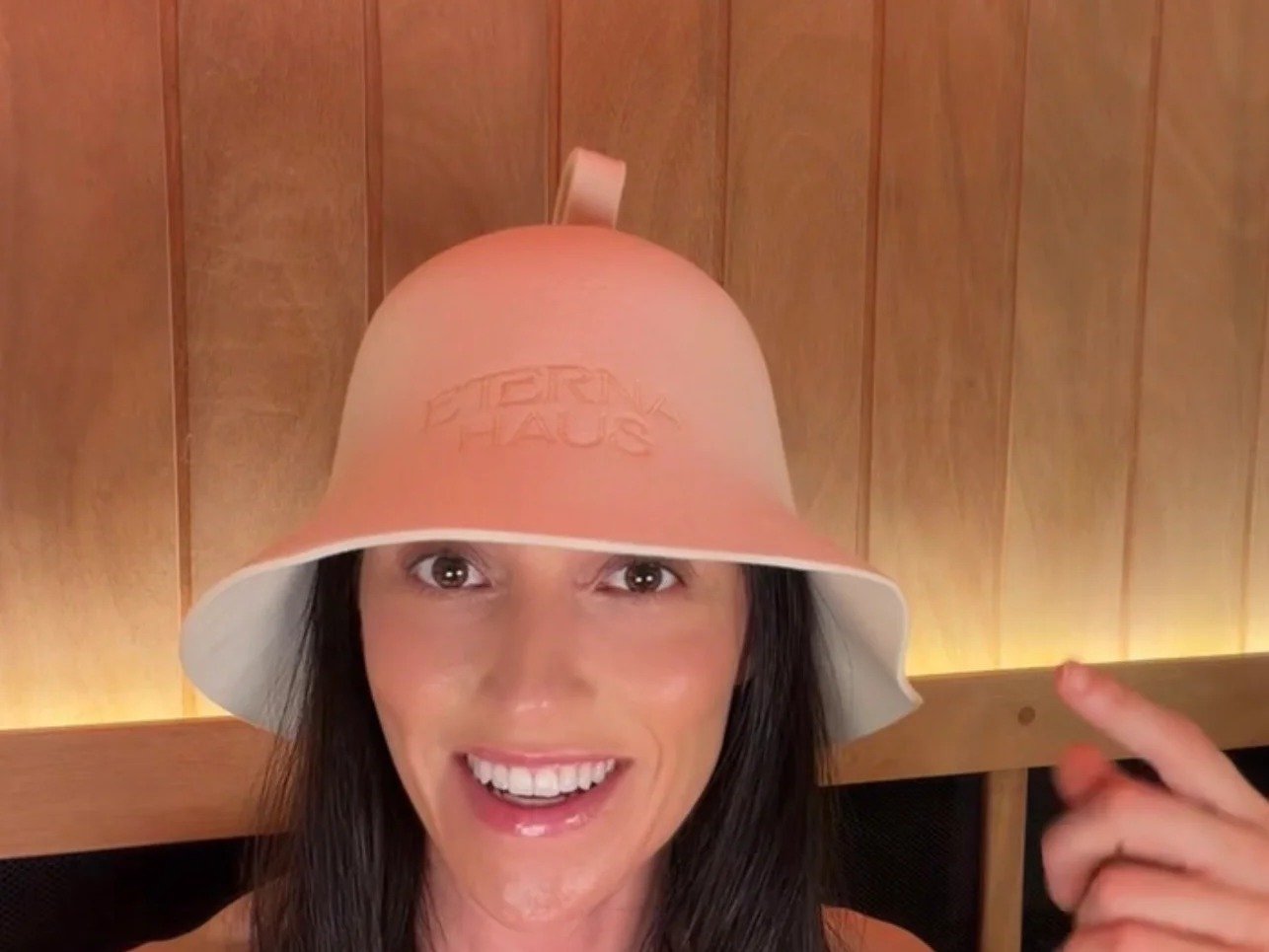 Smiling in the ETERNA HAUS Merino Wool Sauna Hat